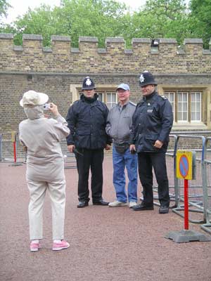 Darla photographs Chuck with the London bobbies